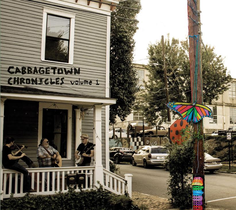Three people playing music on a Cabbagetown front porch