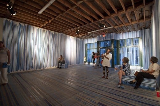 Susan Loftin transforms the space with blue tape. (All photos courtesy of Dashboard Co-op and Batterman Photography)