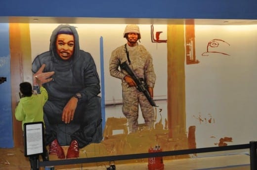 Gaia at work on his mural. Courtesy Center for Civil and Juan Rights.