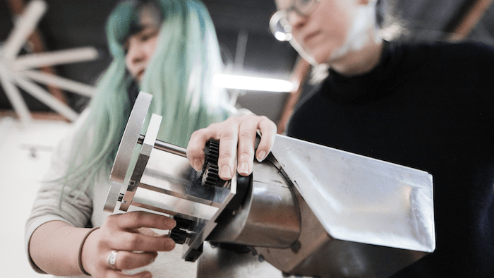 Two designers collaborate at the Second Story lab.